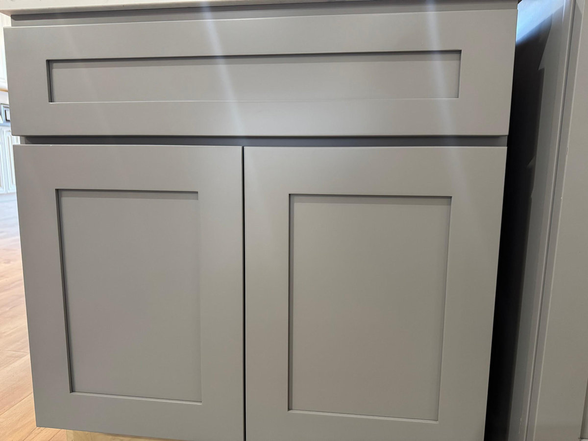 Light grey shaker style cabinet